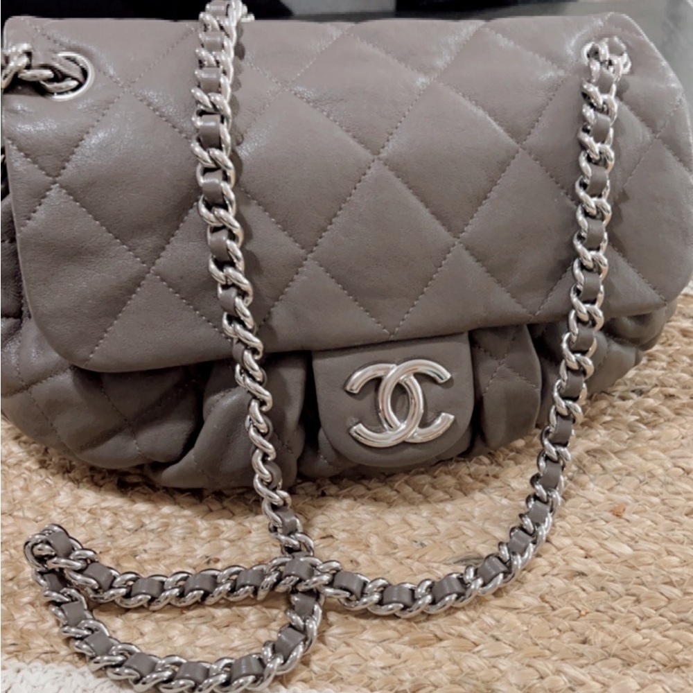 CHANEL shoulder crossbody calfskin leather bag in Gray silver color .